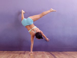 Desi - one-arm handstand on wall - straight leg